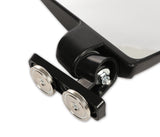 Close-up of a black mirror featuring two wheels, showcasing its sleek design and reflective surface.
